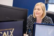 image of calx administrator looking at a computer screen